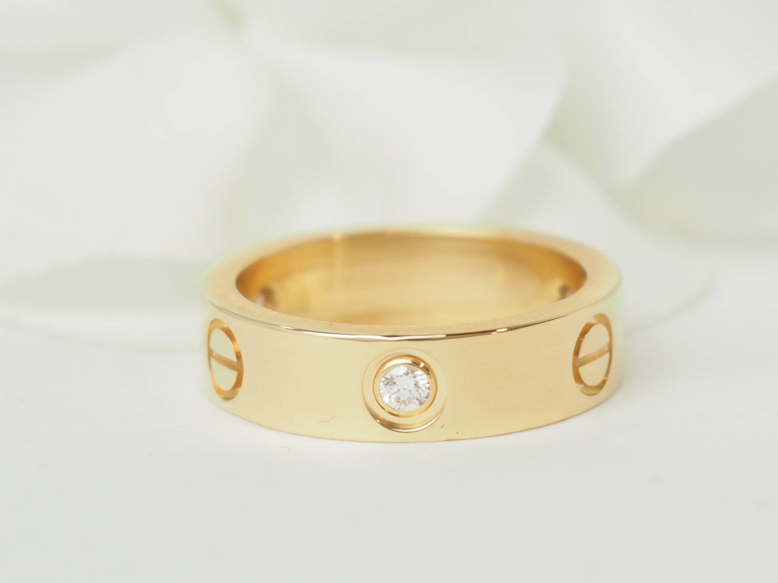Bague Love de Cartier en or jaune et diamants d'occasion